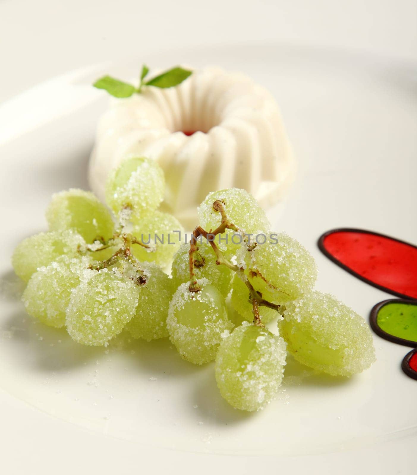 Close up Panna Cotta with grapes and sugar