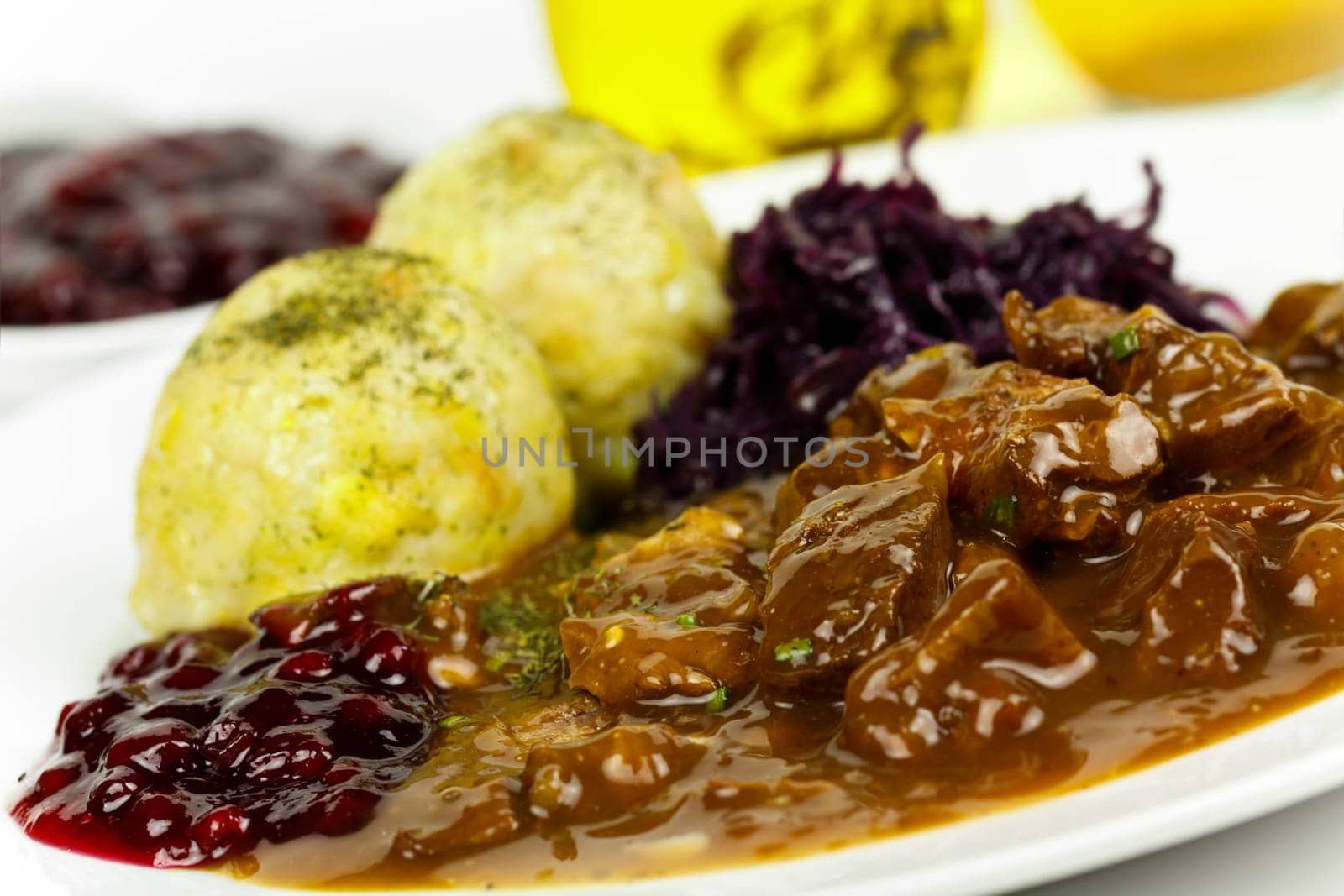 Venison ragout with dumplings,cream,red cabbage,cranberries
