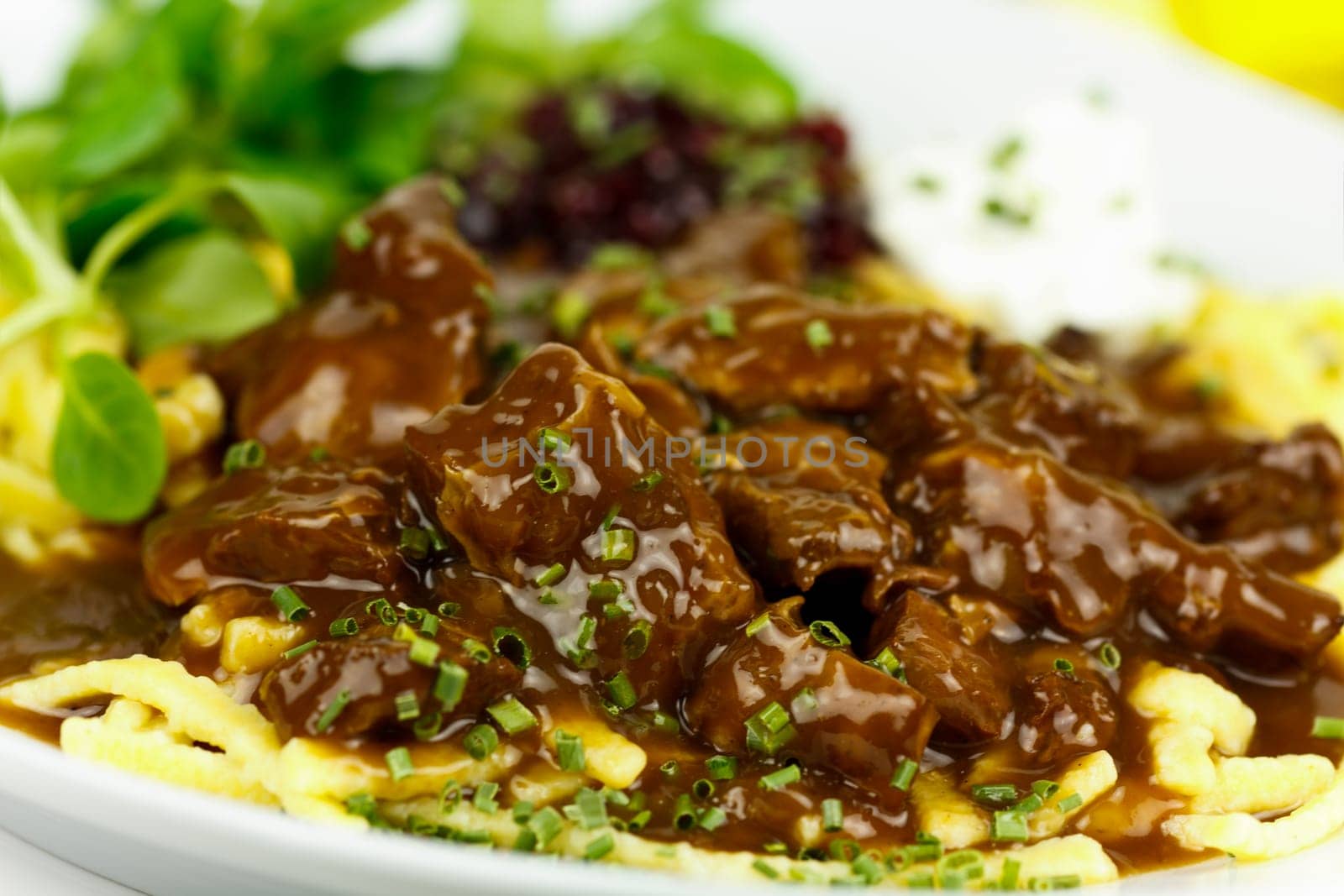 Venison ragout with spaetzle,cream,cranberries,lamb's lettuce
