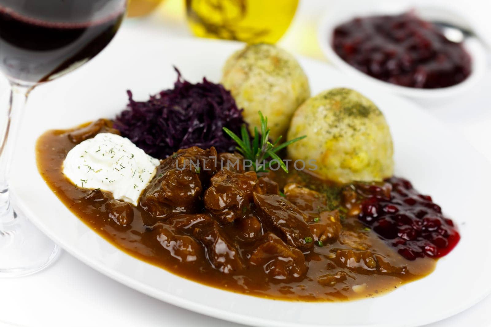 Venison ragout with dumplings,cream,red cabbage,cranberries