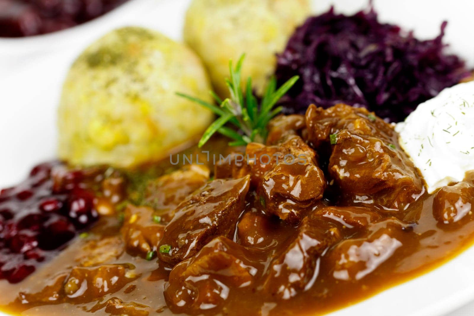 Venison ragout with dumplings,cream,red cabbage,cranberries
