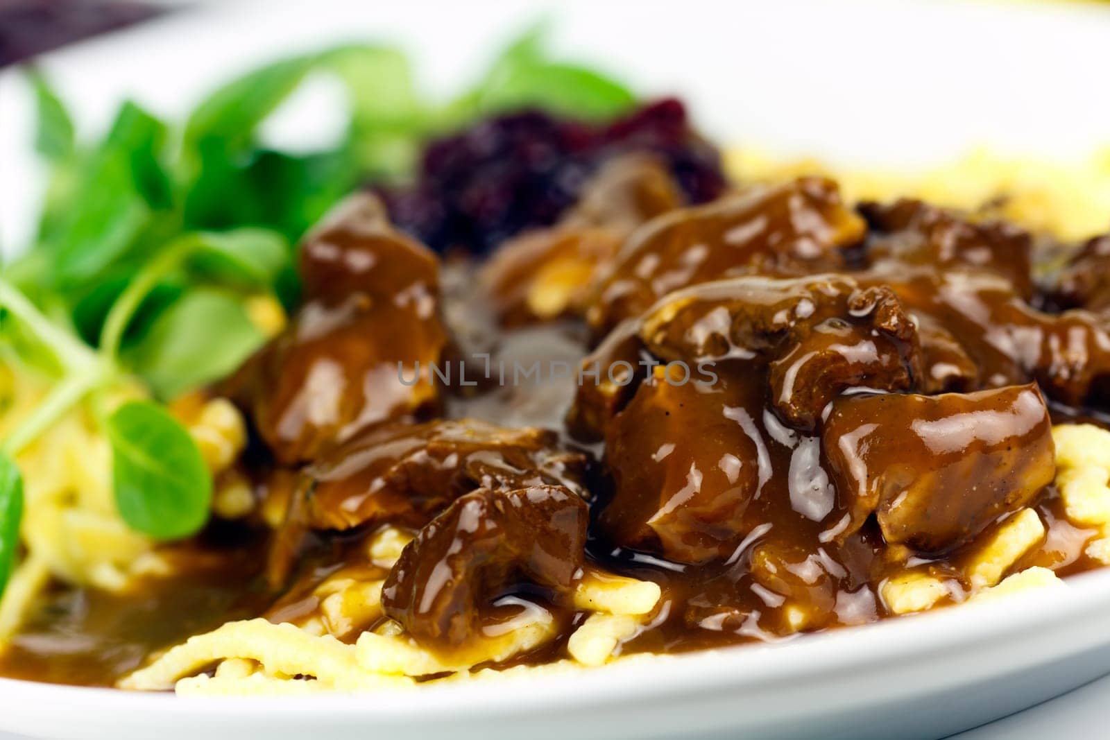 Venison ragout with spaetzle,cream,cranberries,lamb's lettuce