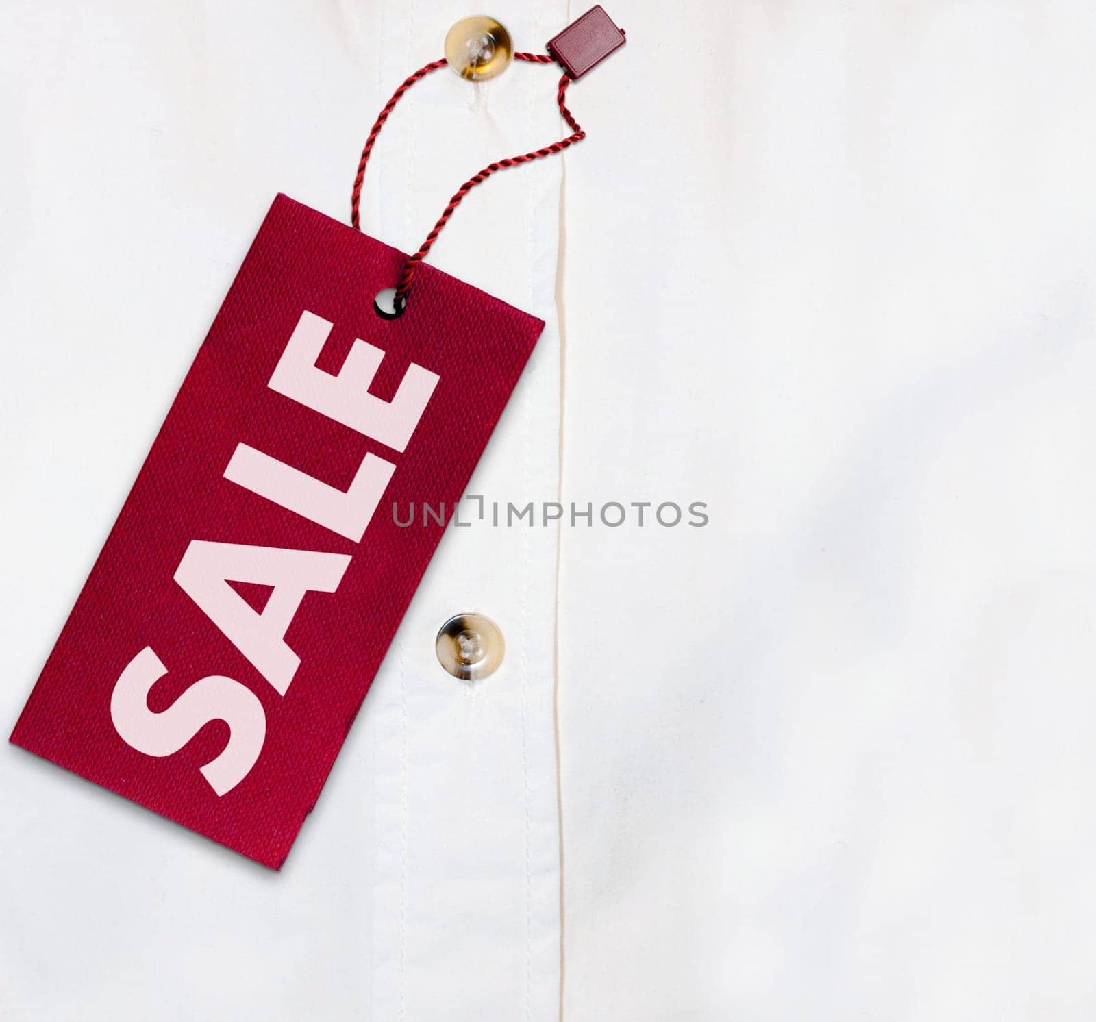 Red Sale Sign on White Shirt - With Copyspace