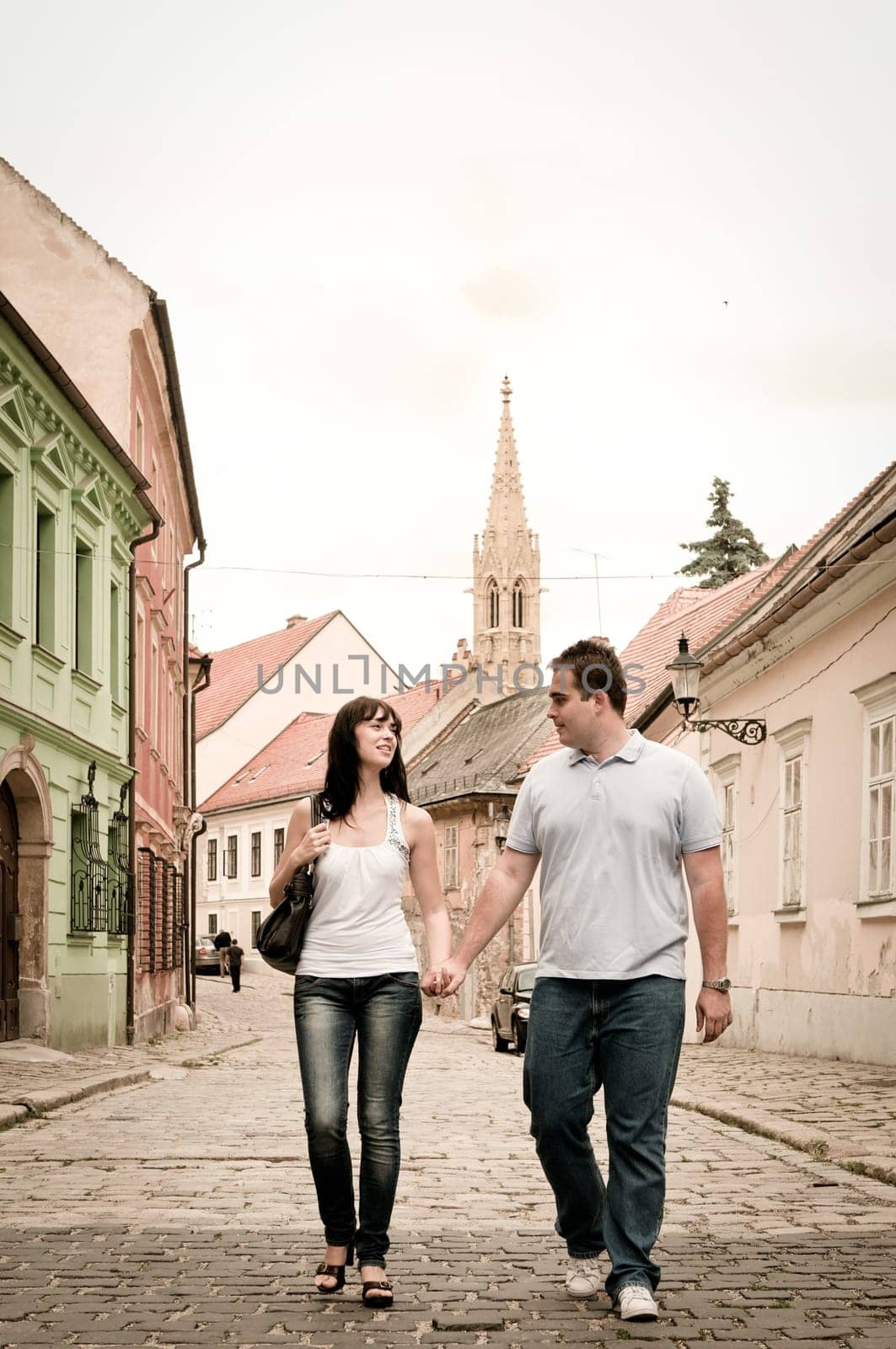 Young couple walking in old town of Bratislava (capital of Slovakia)