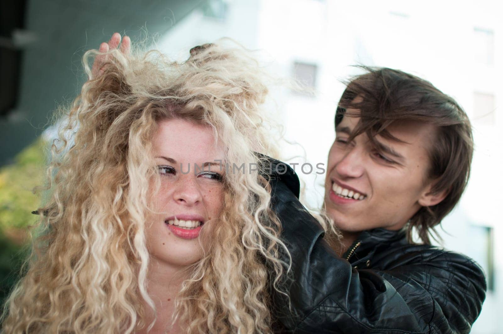 Ruffle hair - couple outdoors