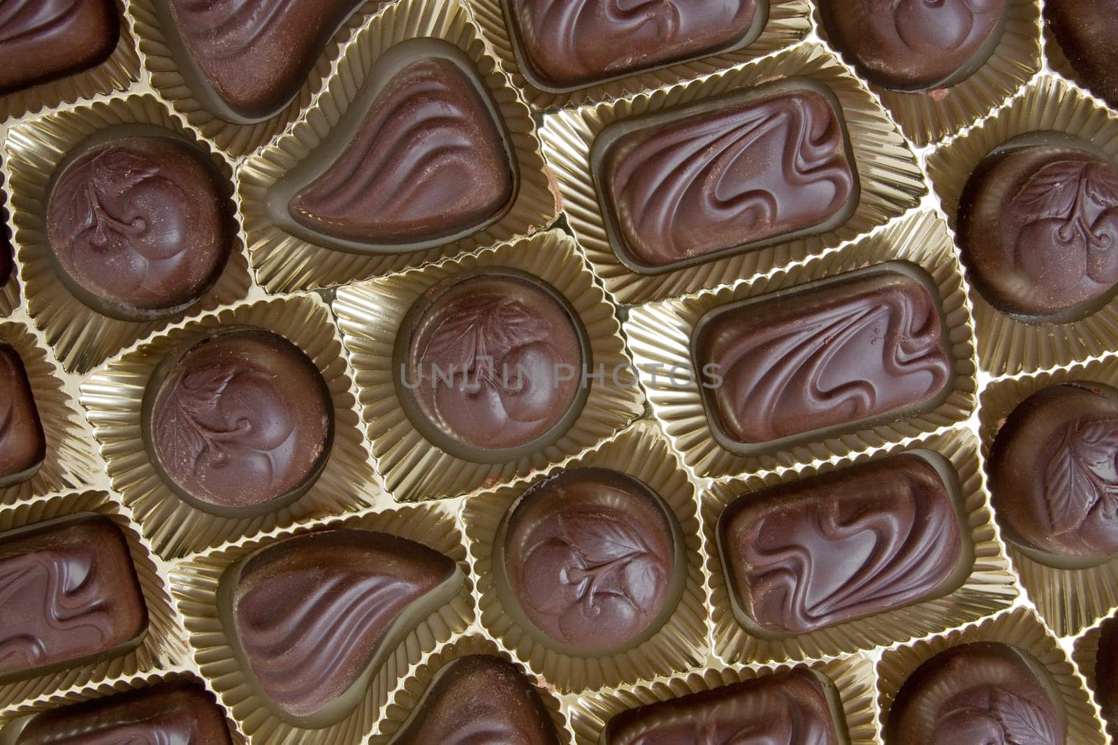 dark chocolate pralines in a golden box