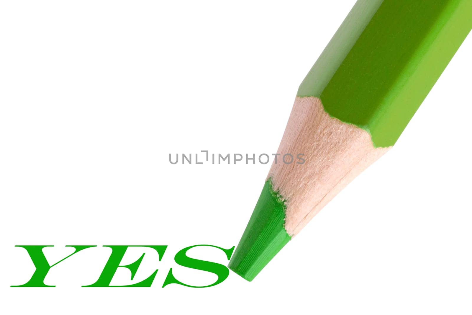 green pencil writing word "yes"". isolated on white background"
