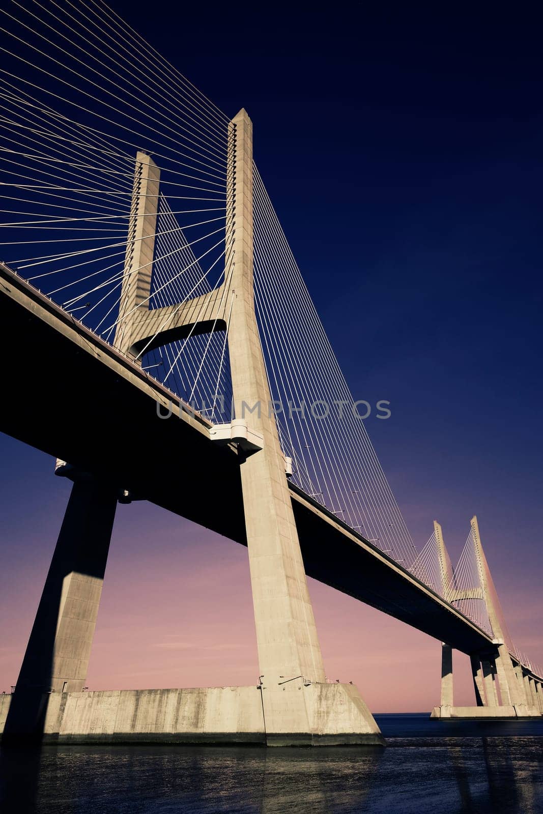 sunset on Vasco da Gama bridge in Lisbon, Portugal