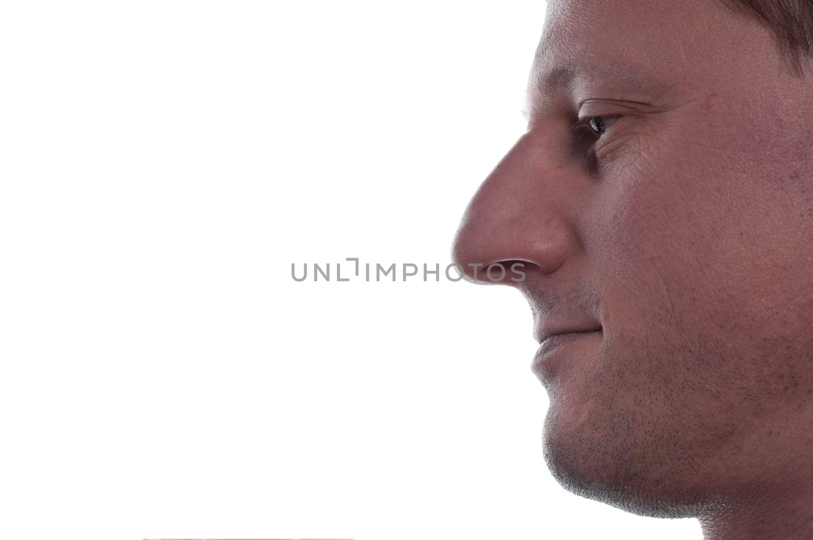 An unshaven man thinks