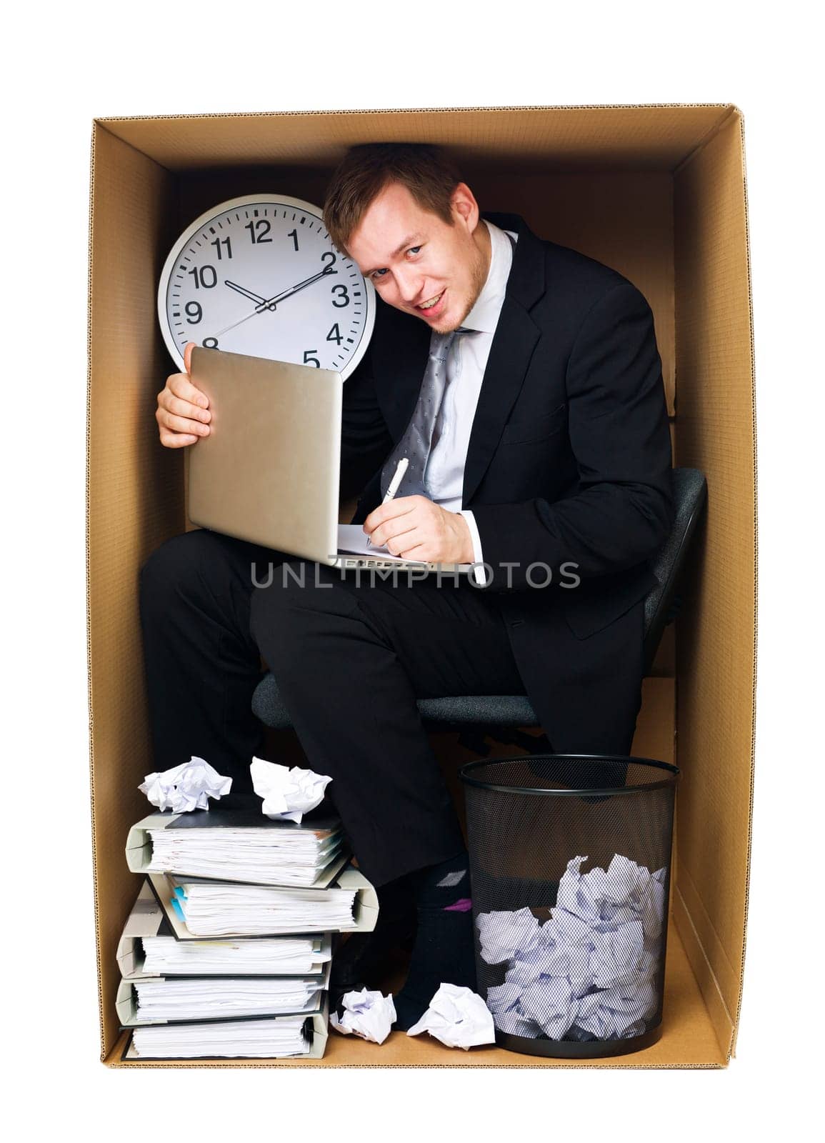 Businessman in a very tight office isolated on white background