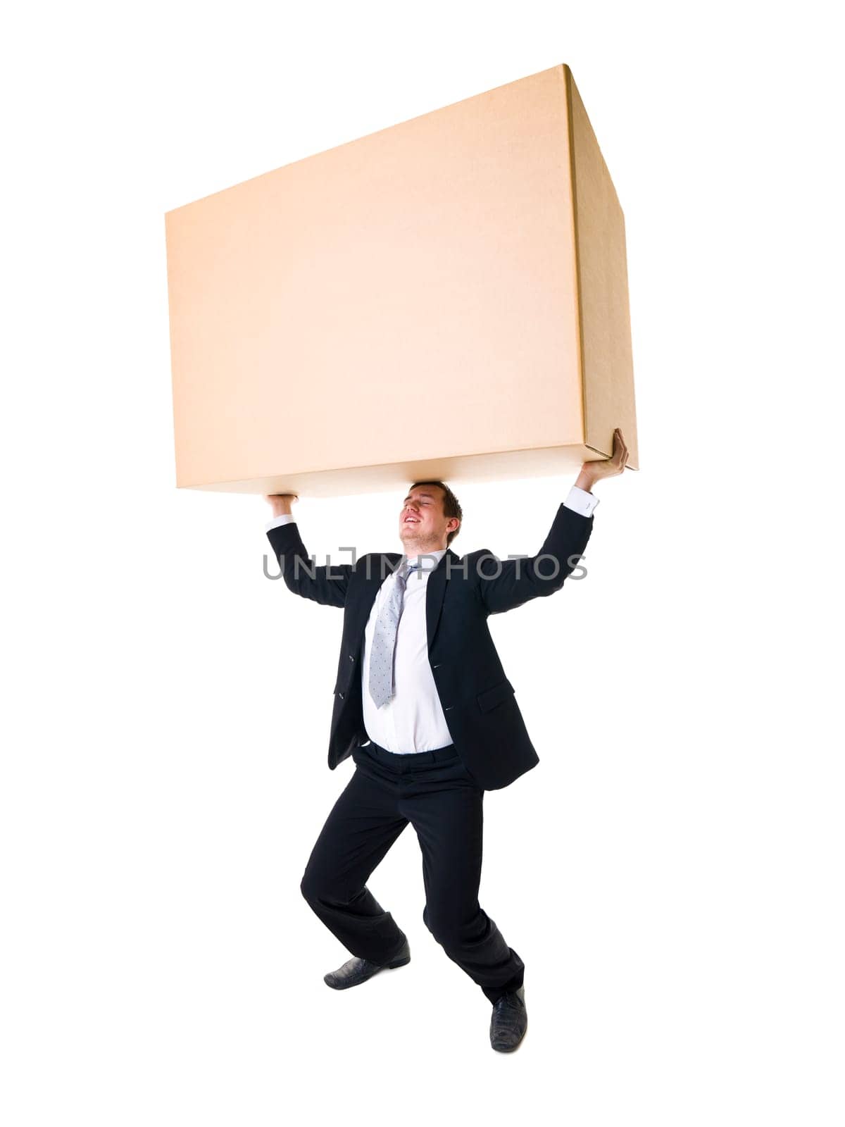 Well dressed man carrying a heavy cardboard Box isolated on white background