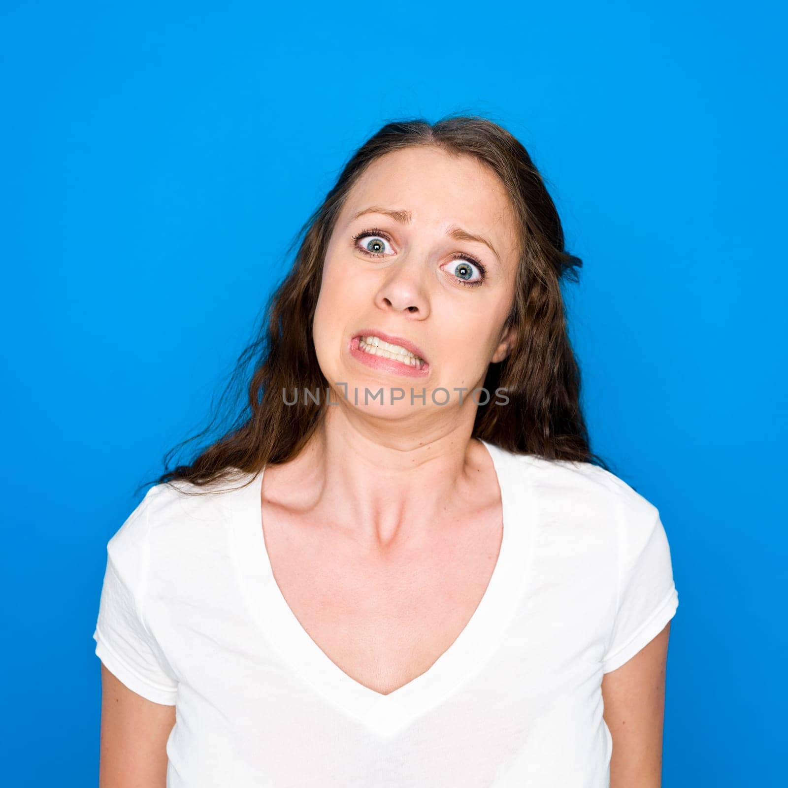 Portrait of a young girl on blue background