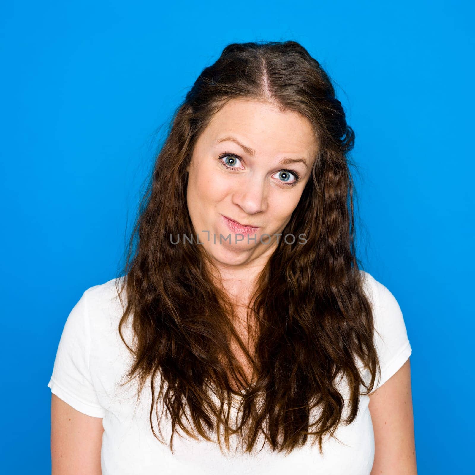 Portrait of a young girl on blue background