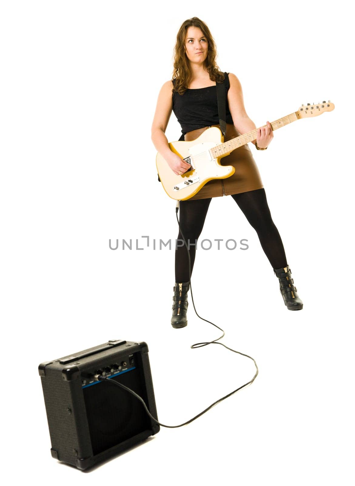 Young woman playing electric guitar isolated on white background
