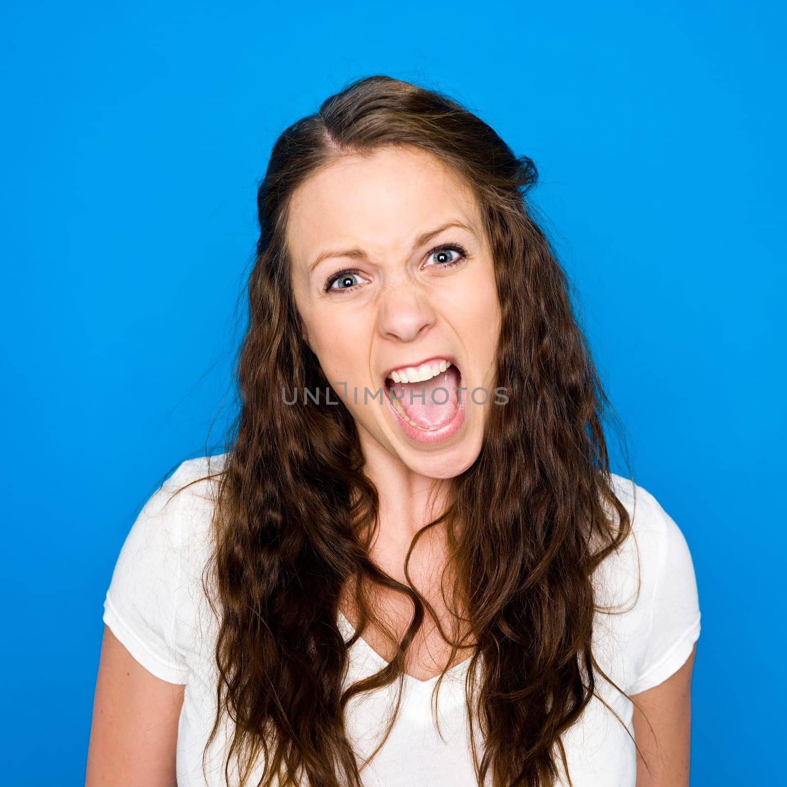 Portrait of a young girl on blue background