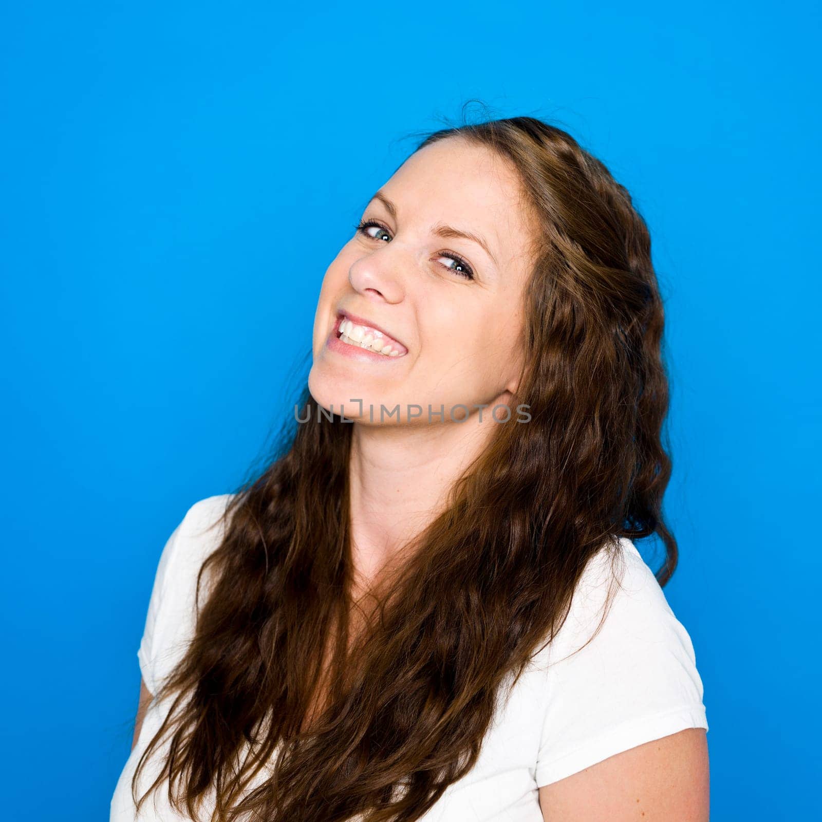 Portrait of a young girl on blue background