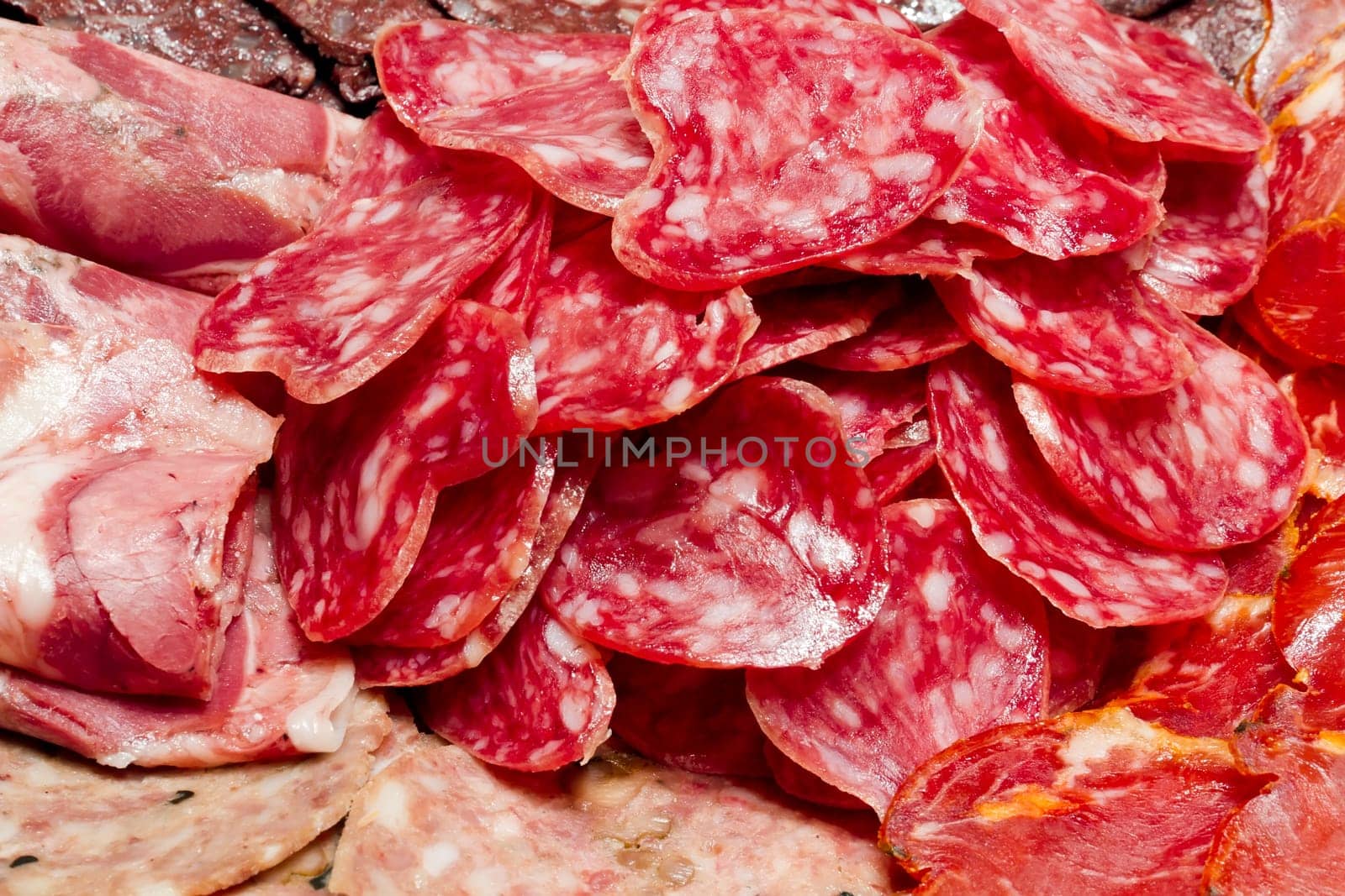 a lot of Spanish serrano ham and Spanish sausage, fuet, Iberian pork loin