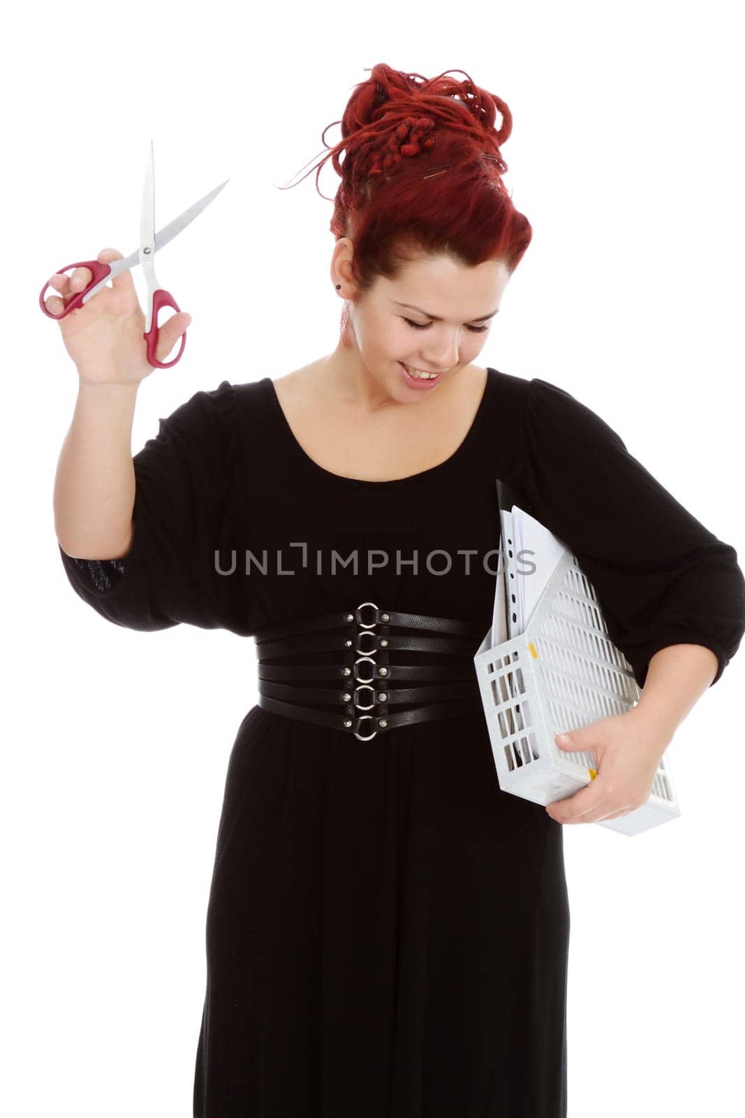 Smiling red-haired accountant with scissors and a folder with documents isolated on white background