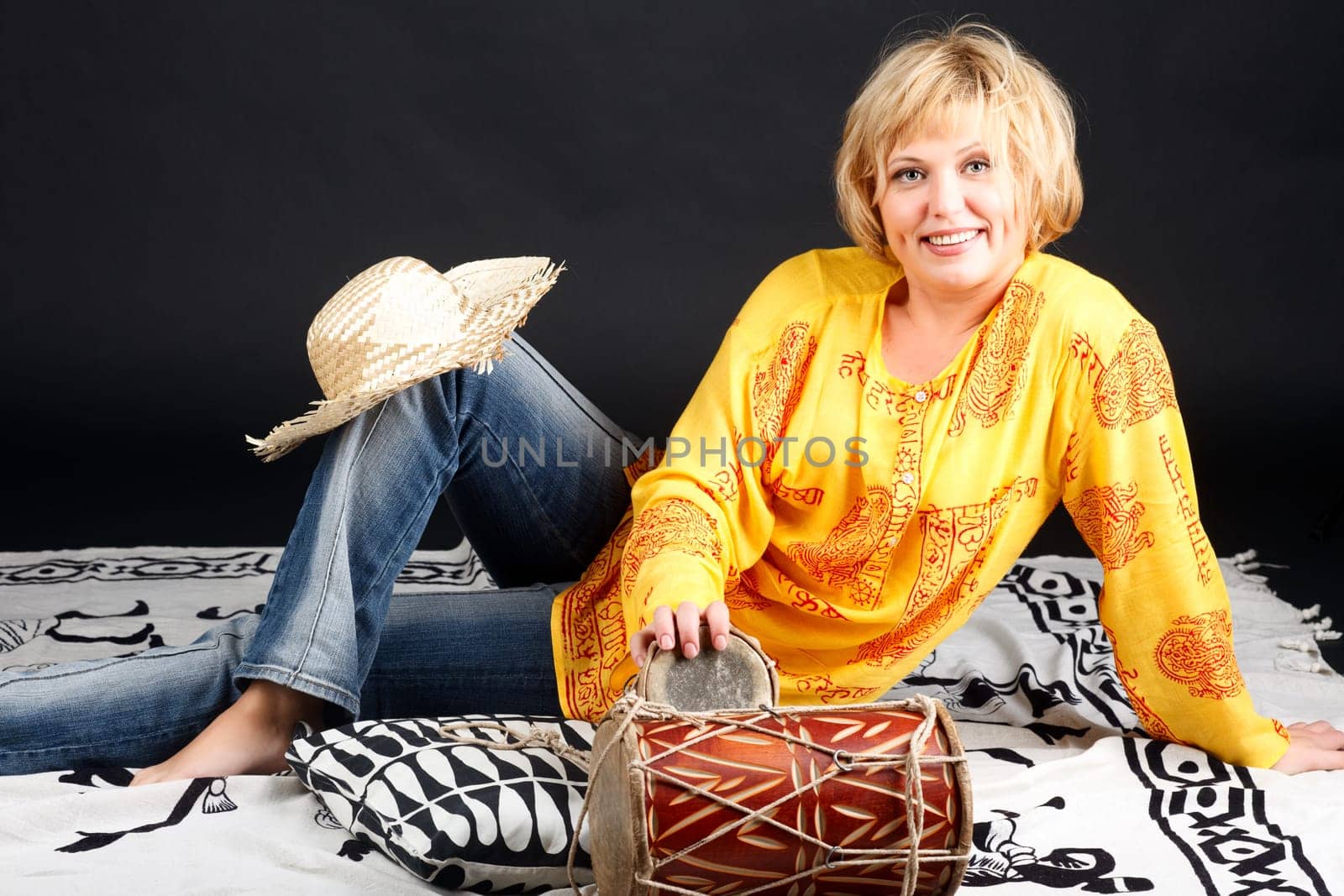 Portrait of attractive woman with drums.