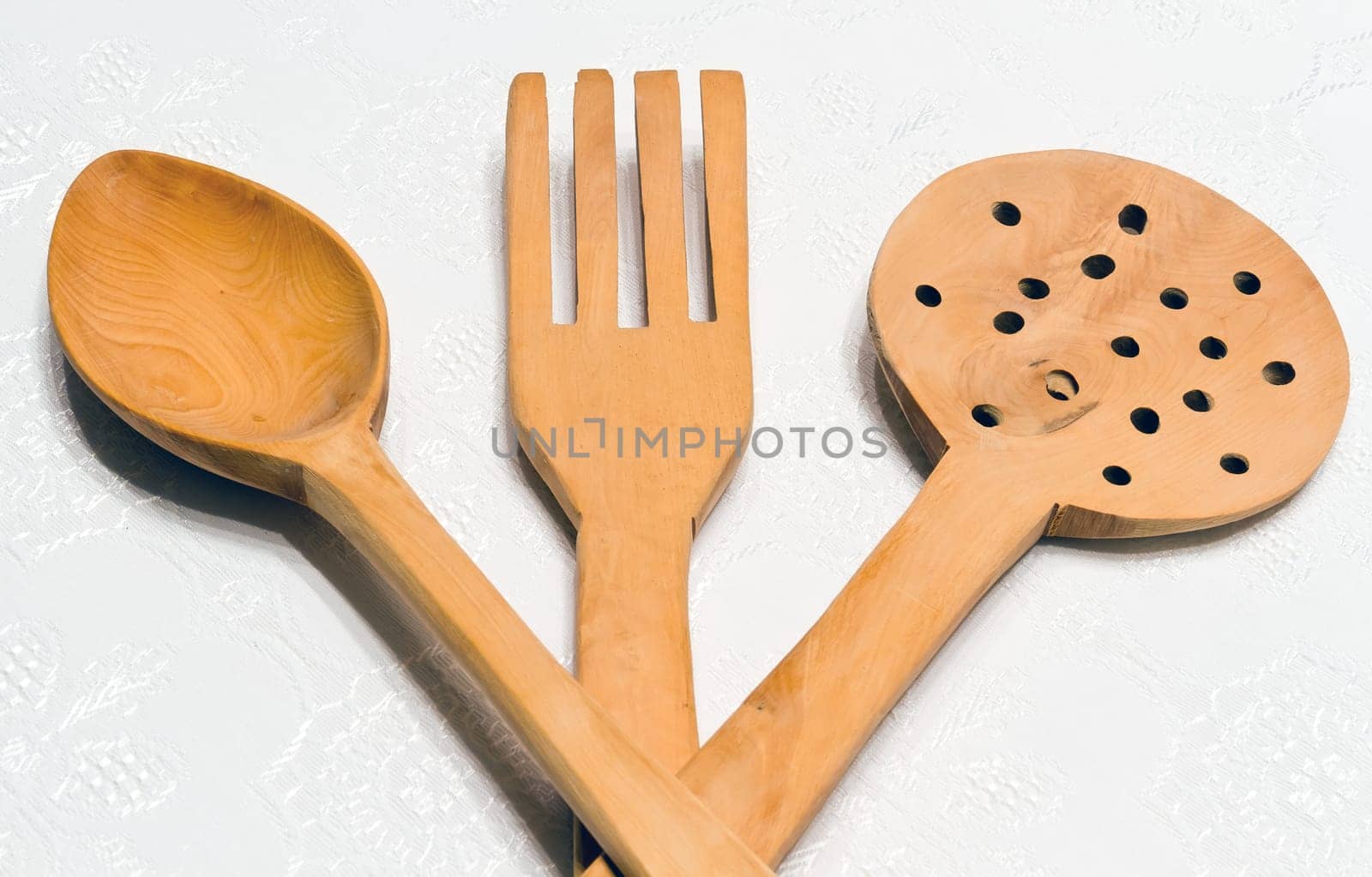 Wooden kitchen utensils set, isolated on white.