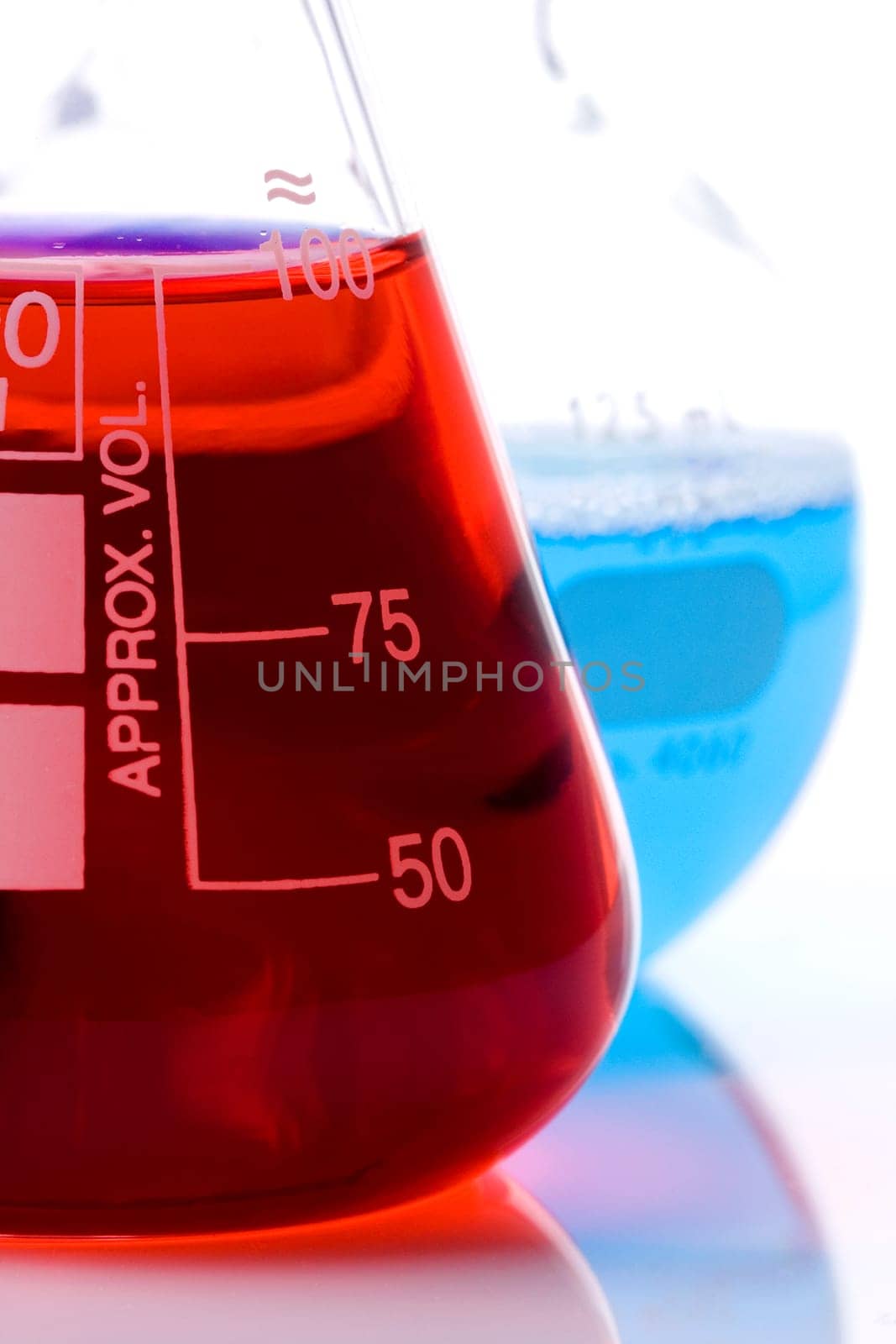 One blue and one red laboratory flask used in scientific research