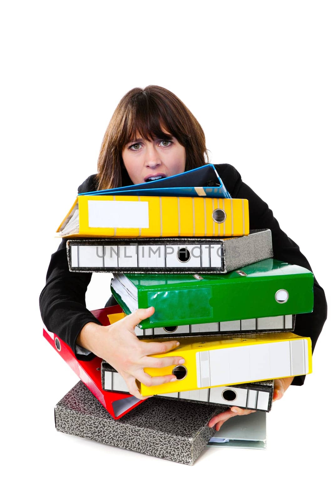 Stressed female office worker with folders. Studio shot, isolated on white background