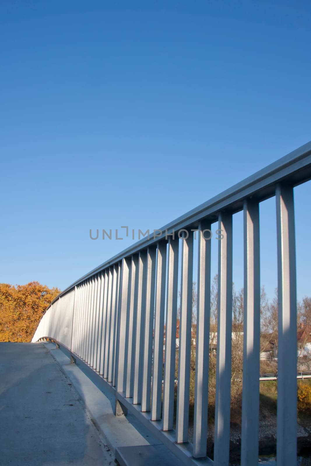 Right half of a bridge from a low angle against blue sky