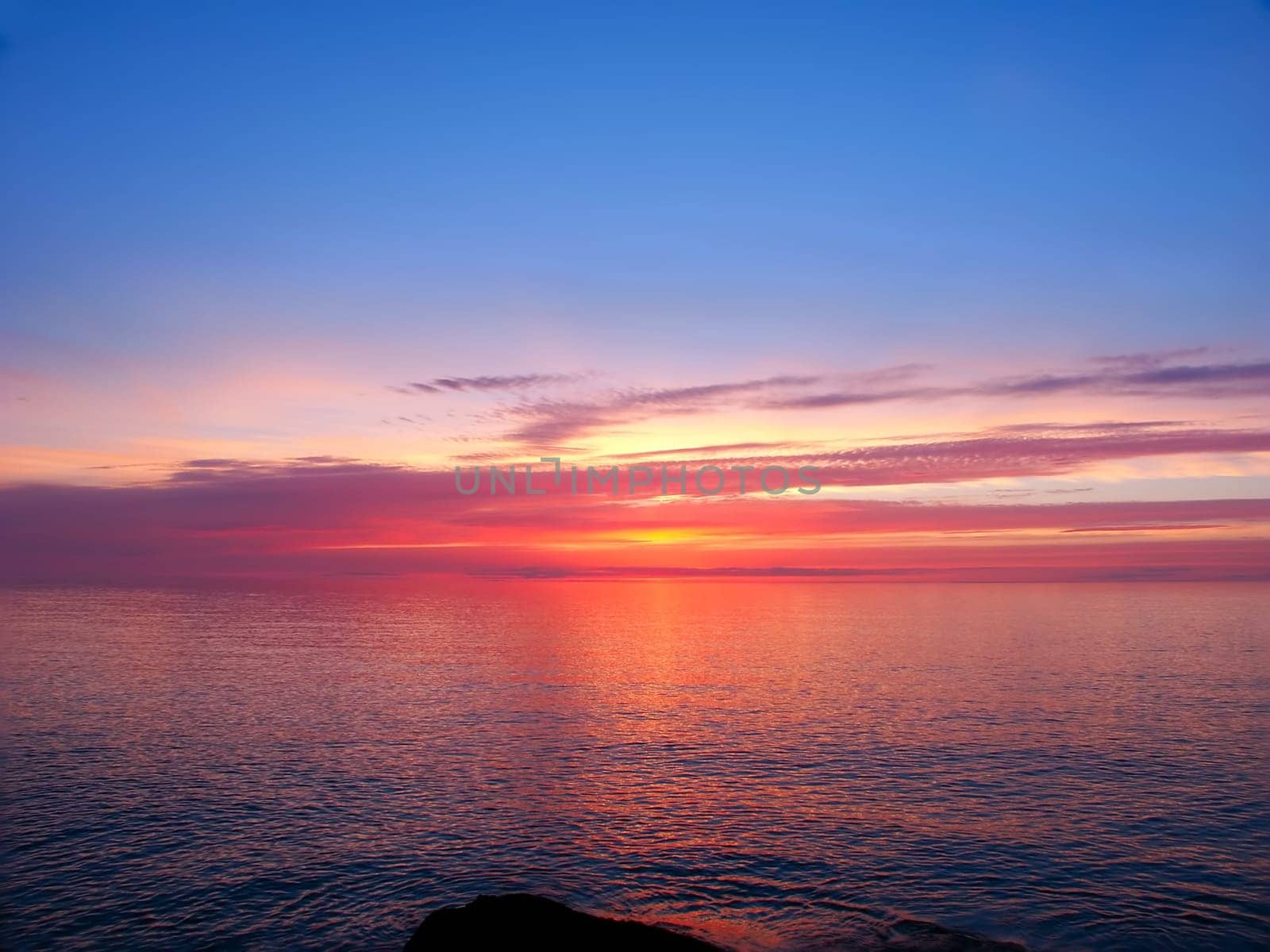 Beautiful pink colors reflect off Lake Superior in northern Michigan.
