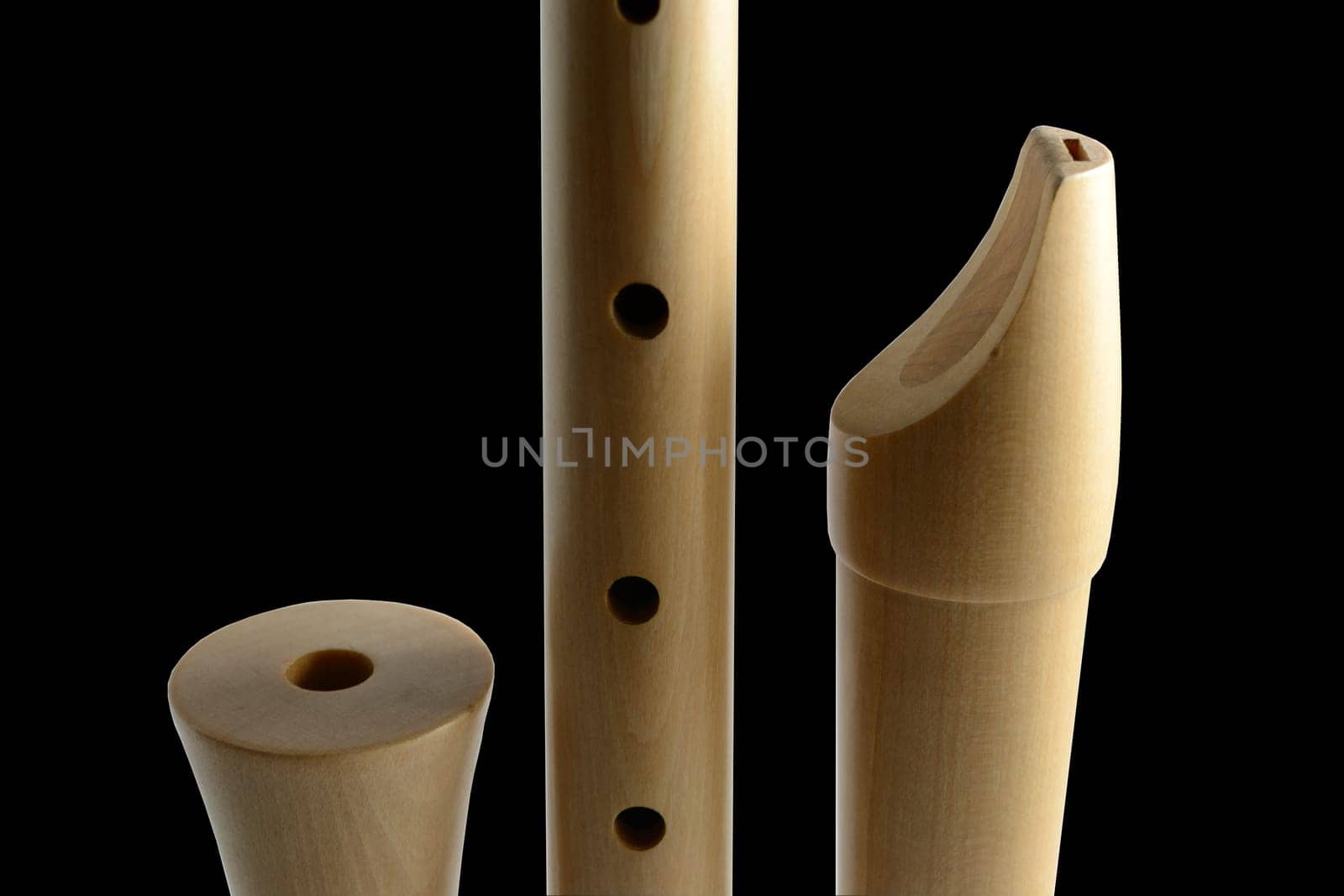 Parts of a wooden recorder made of maple wood