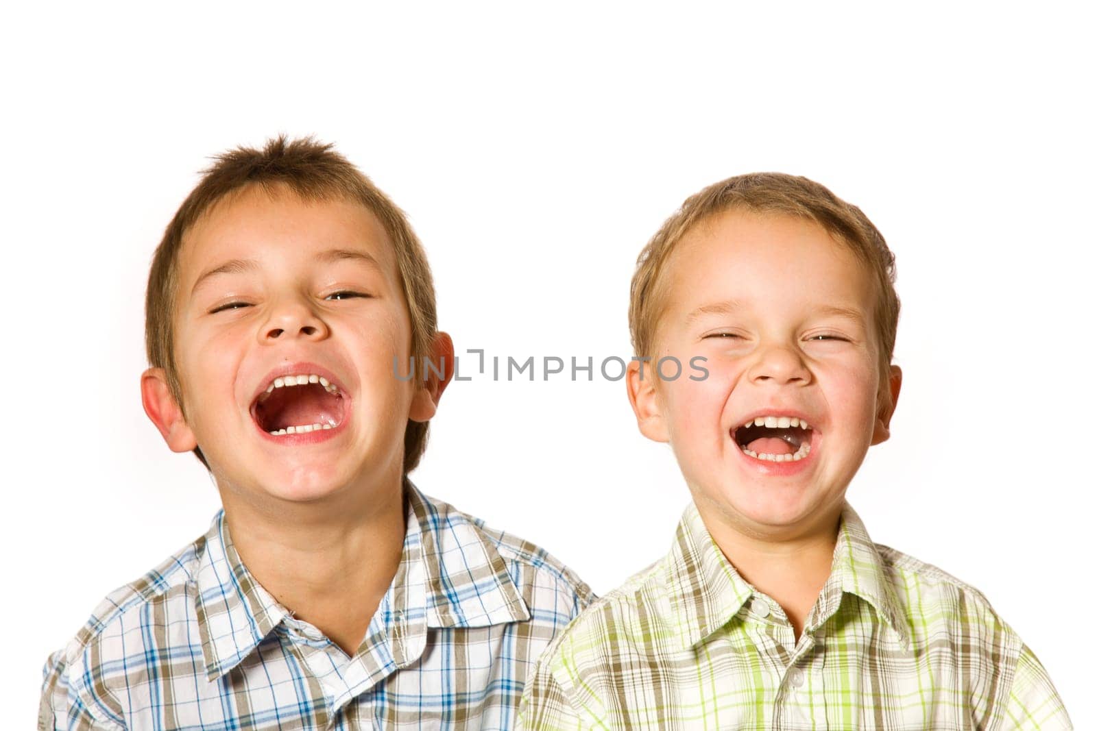 studio shot of two laughing boys
