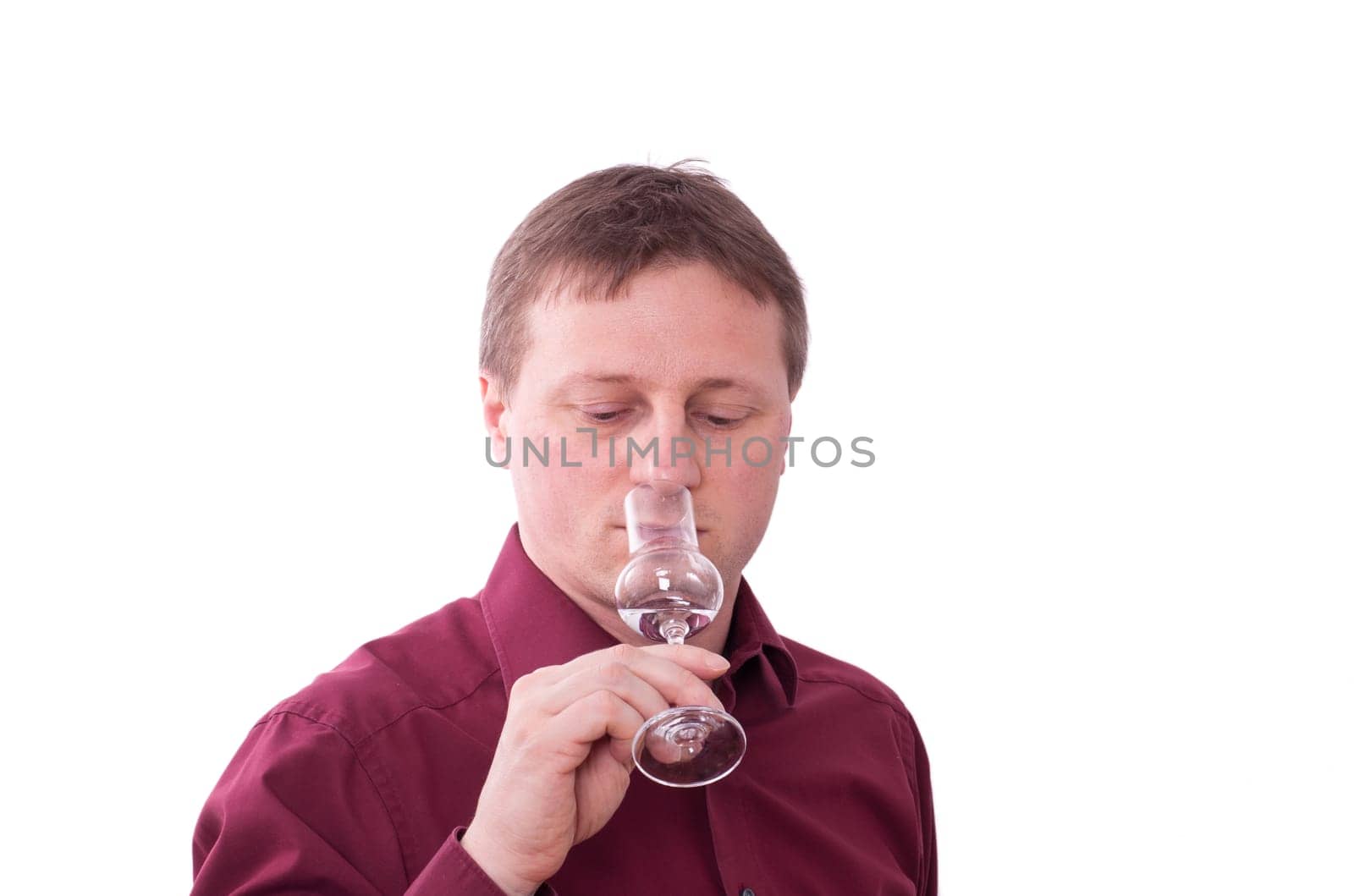 A man smells the scent of a grappa