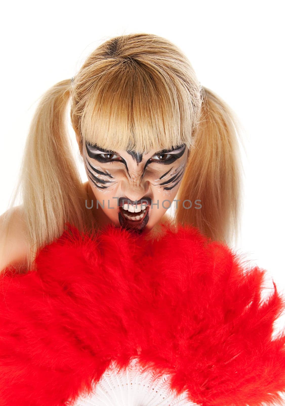 Young woman paint as the wild feline
