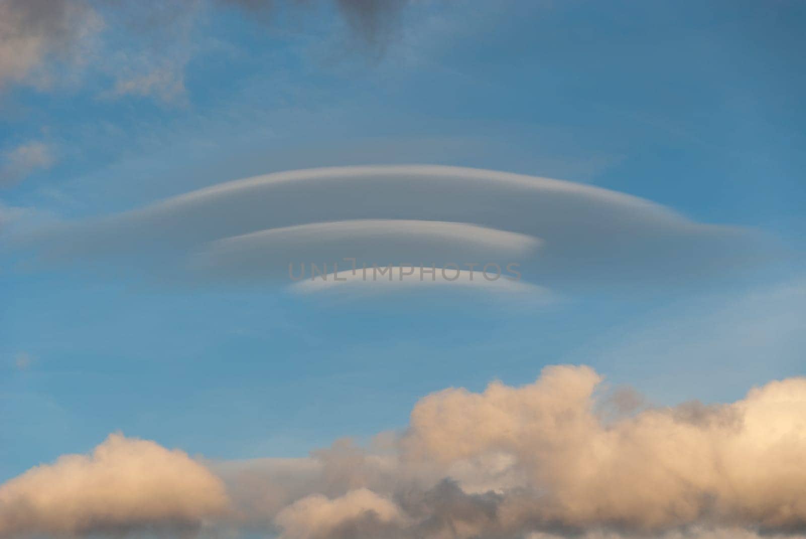 lenticular cloud at sunset in Italy