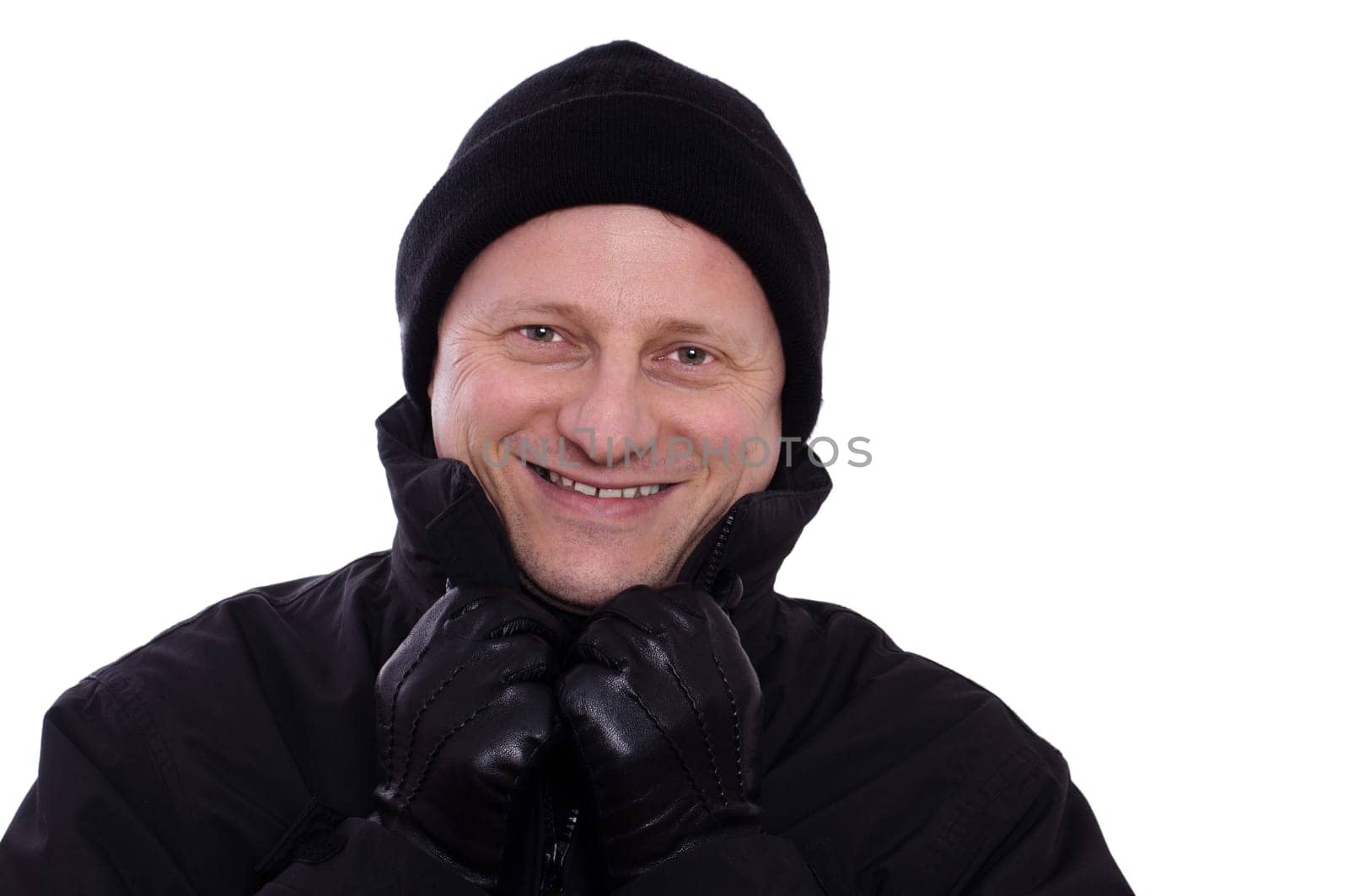 Despite the cold,a man with a hat and gloves laughs