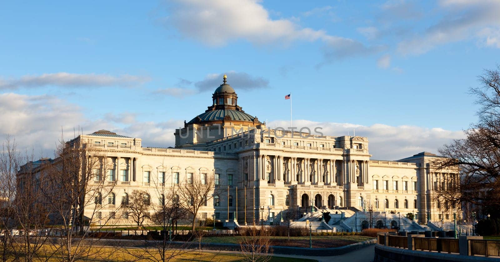 The setting sun lights up the US Library of Congress with warm light in late afternoon