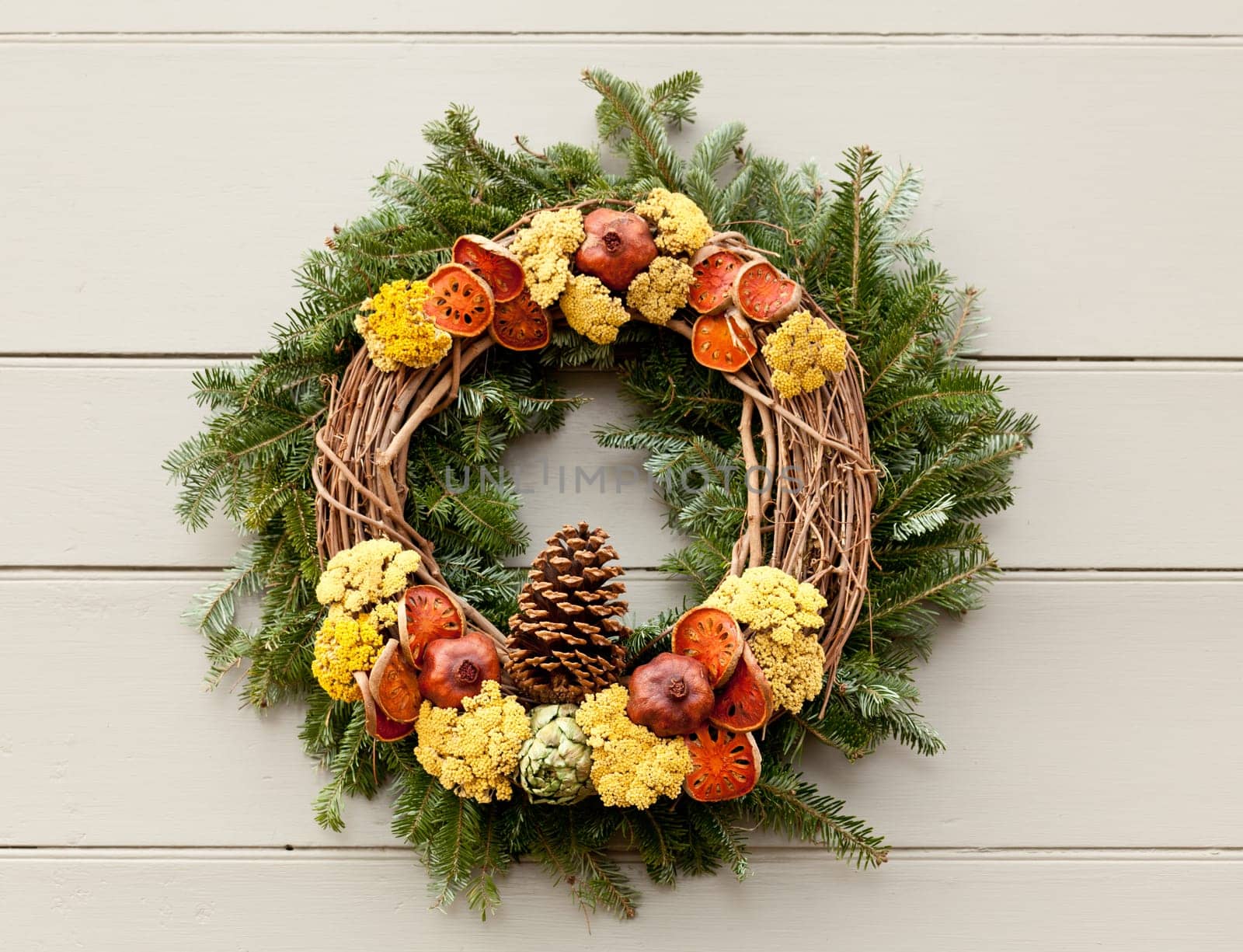 Traditional design of a christmas wreath attached to the front door of old house