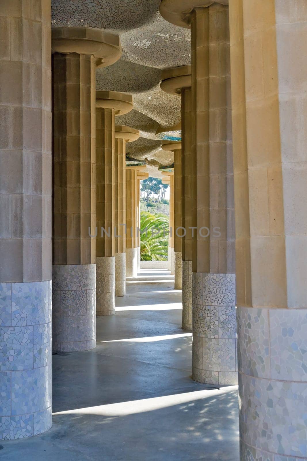 BARCELONA - JANUARY 08: Inclined Columns of the Hypostyle Hall of Park Guell on January 08, 2012 in Barcelona. Also known as Hall of 100 columns, the roof is decorated with mosaics. Built by Gaudi.