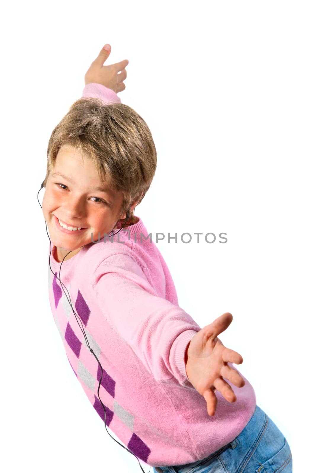 Happy boy with earphones dancing with open arms on isolated  white background