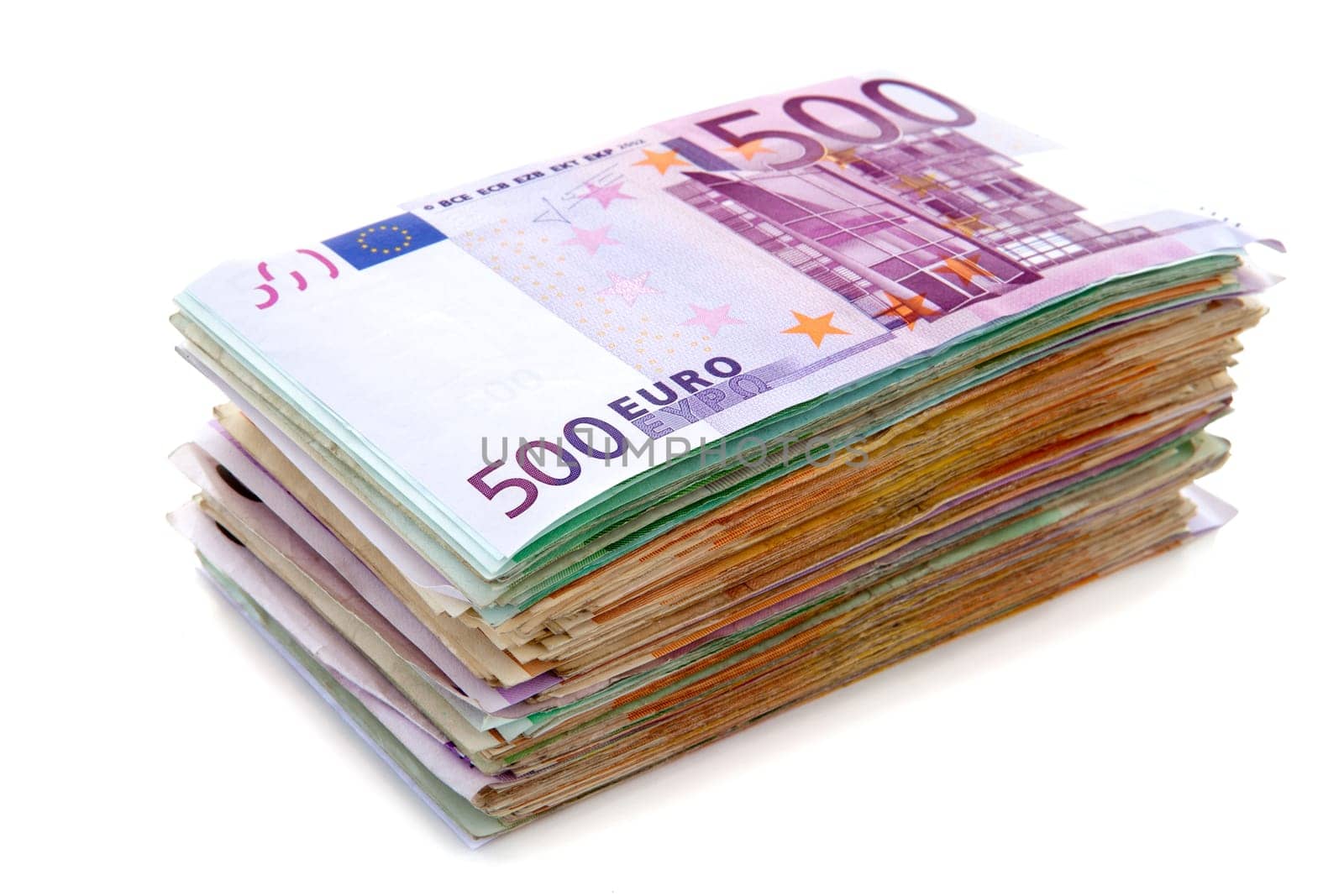 Big pile of euro bank notes isolated on white