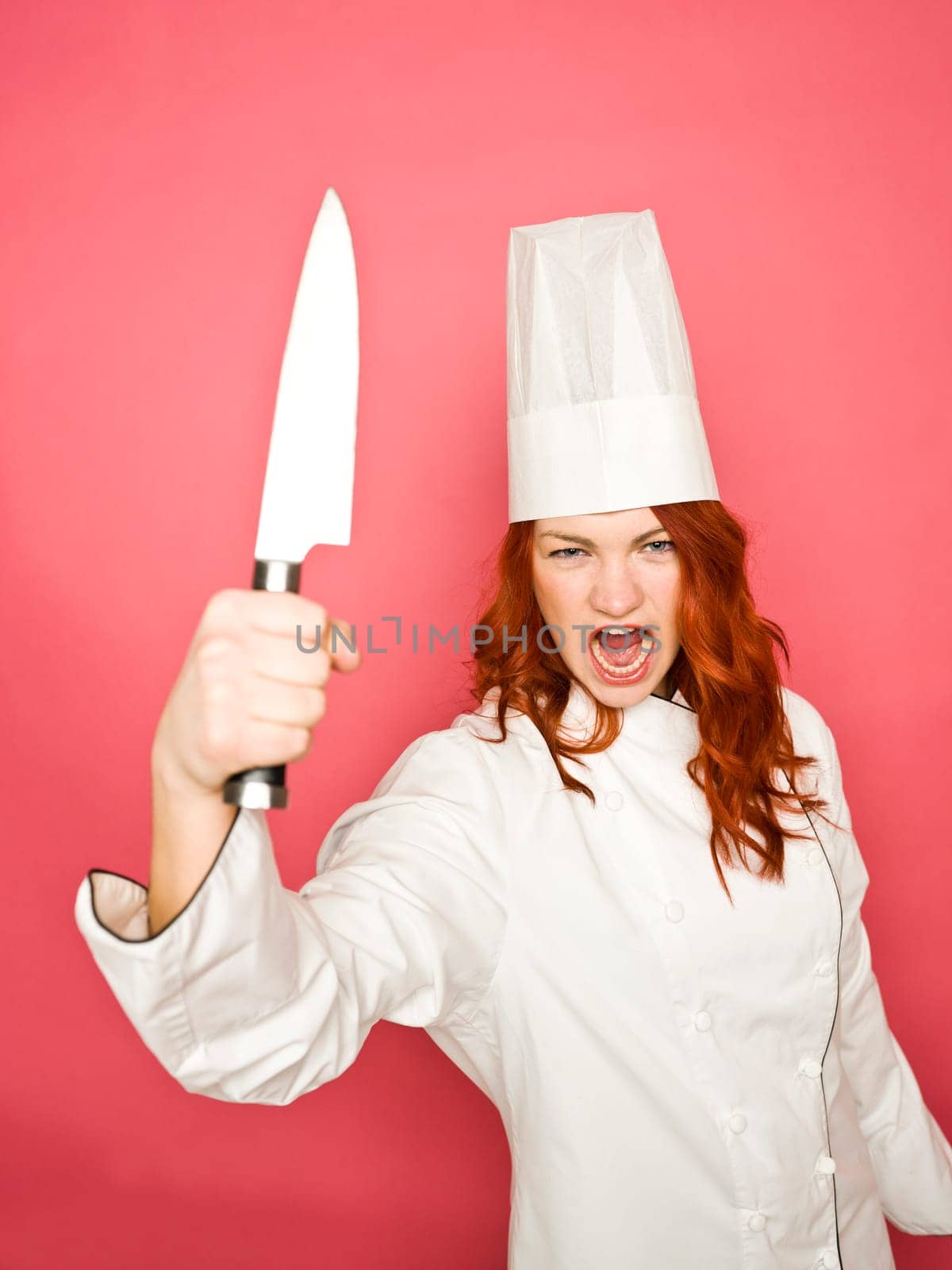 Female Chef on pink background