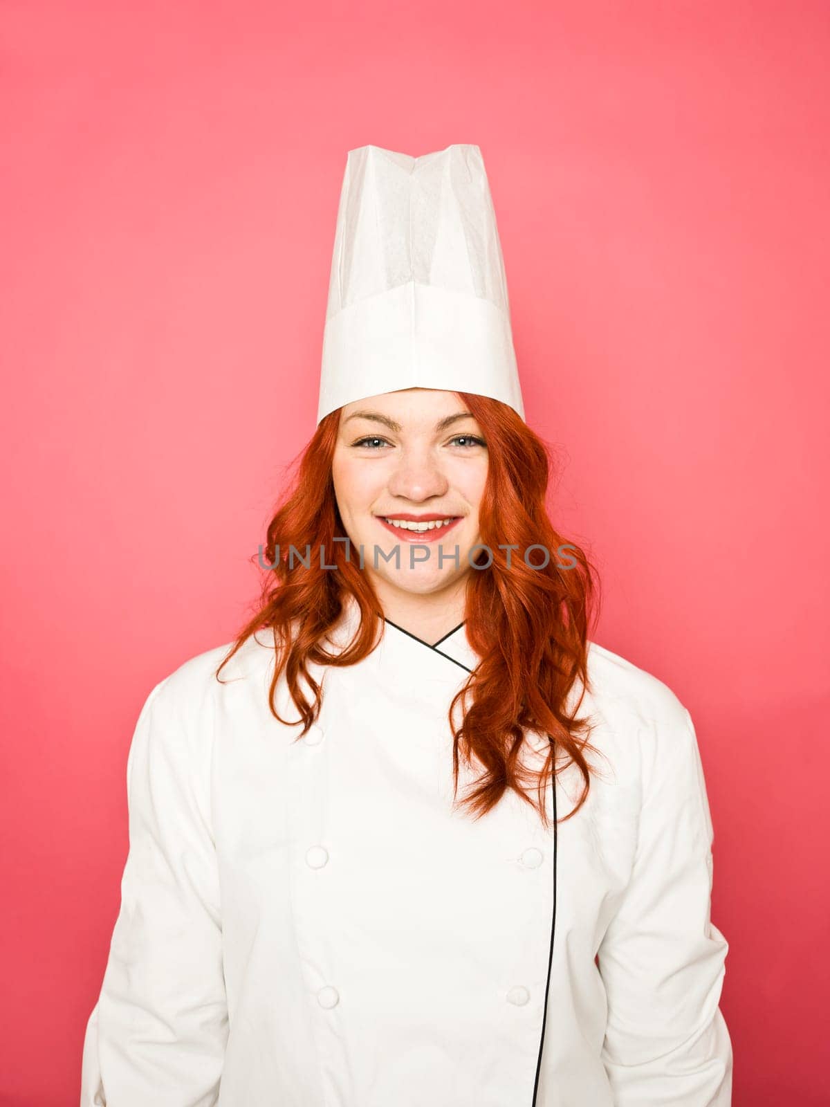 Female Chef on pink background
