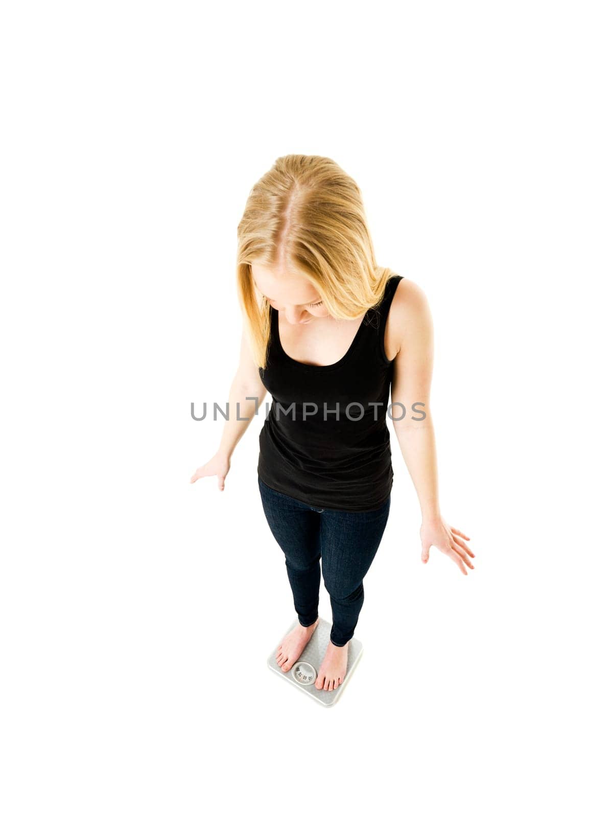 Young Girl on weight scale isolated on white background