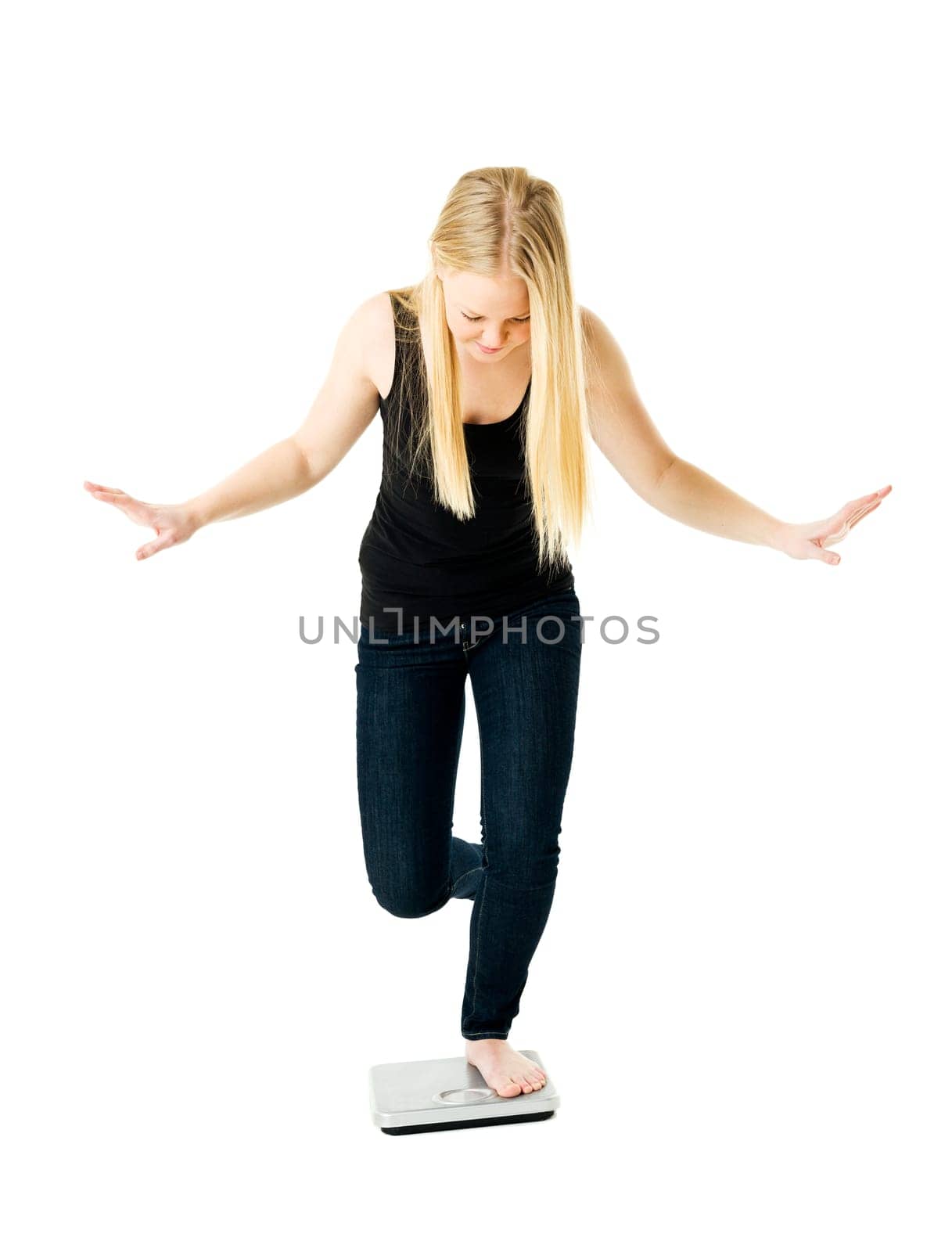 Young Girl on weight scale isolated on white background