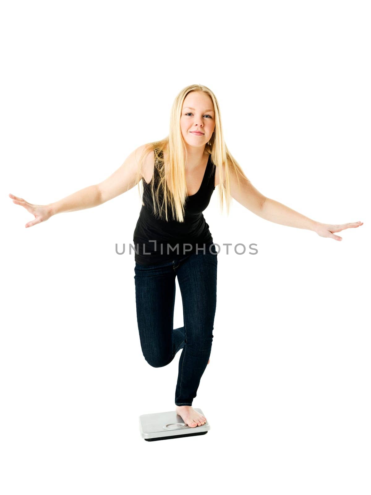 Young Girl on weight scale isolated on white background
