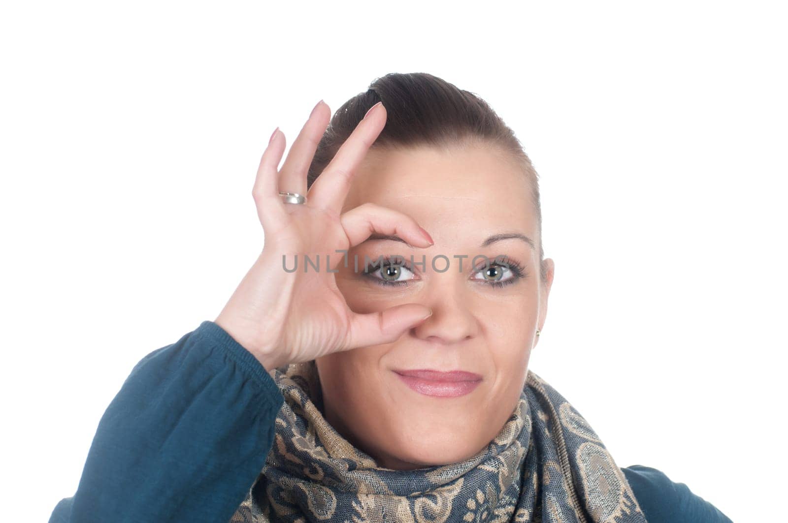 Young woman showing magnifying glass