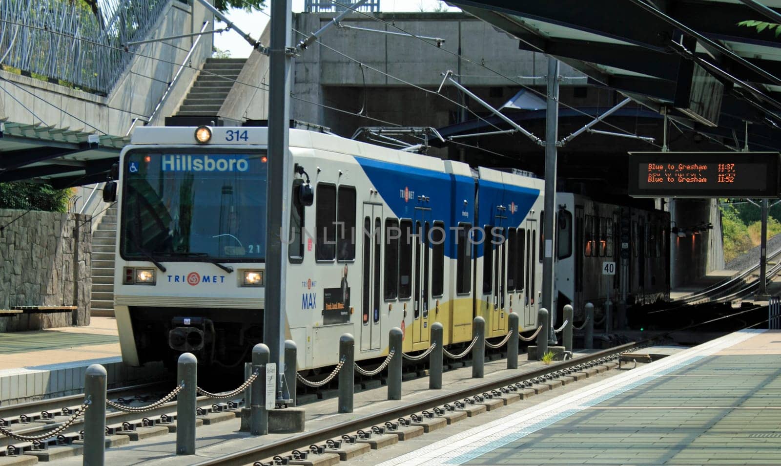 BEAVERTON, OREGON - AUGUST 5: Light rail train arriving at the Beaverton Sunset Transit Center station on August 5, 2010 in Beaverton, Oregon. A central hub for trains and buses since 1998.