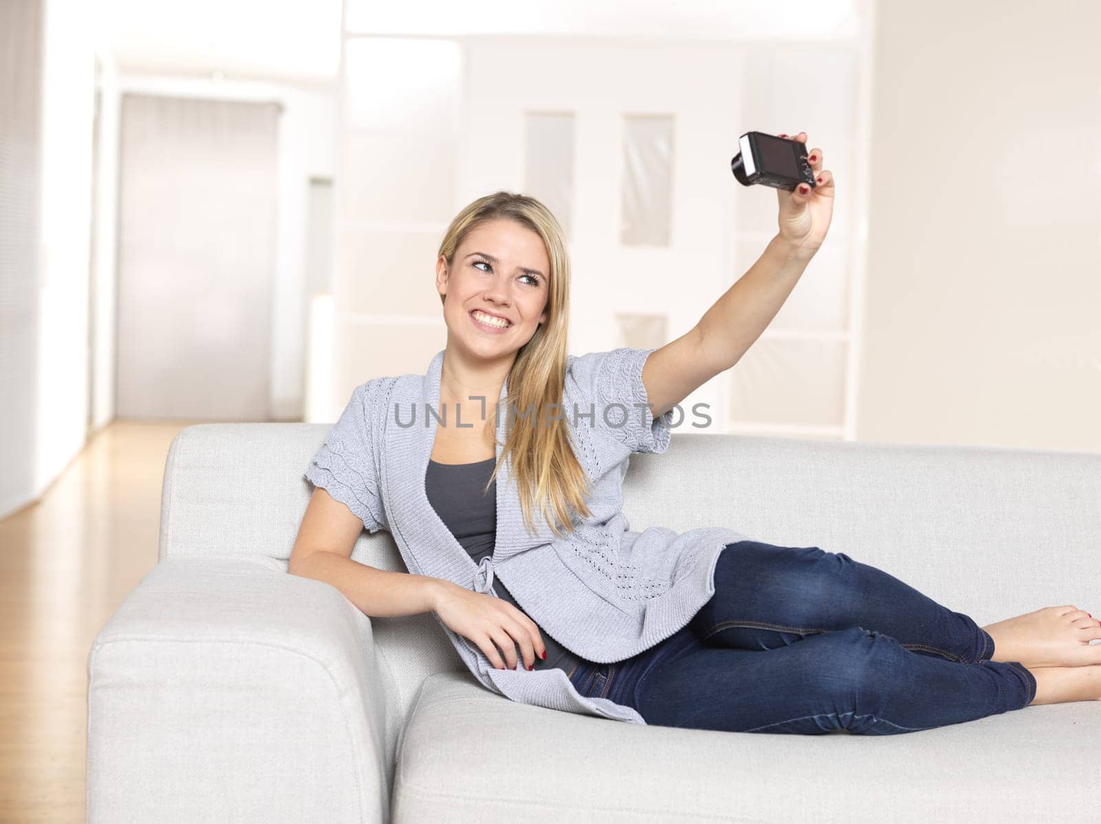 Young woman photographing herself