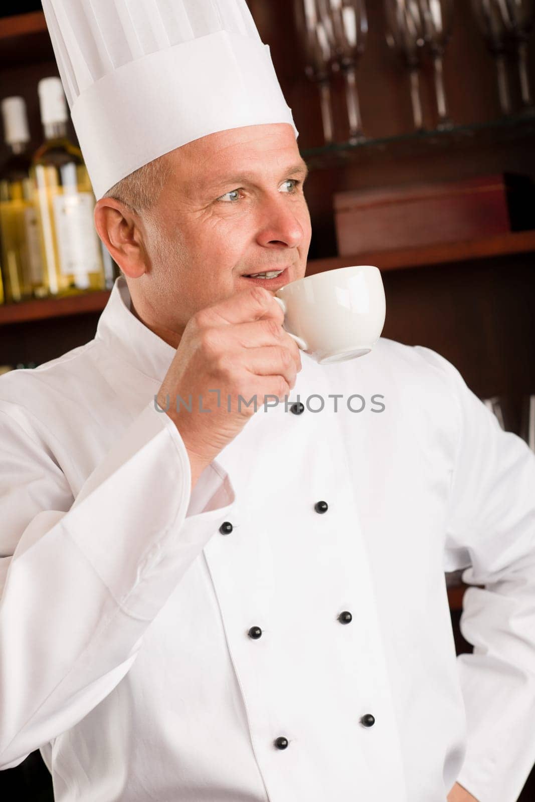 Chef cook relax break enjoy cup of coffee in restaurant
