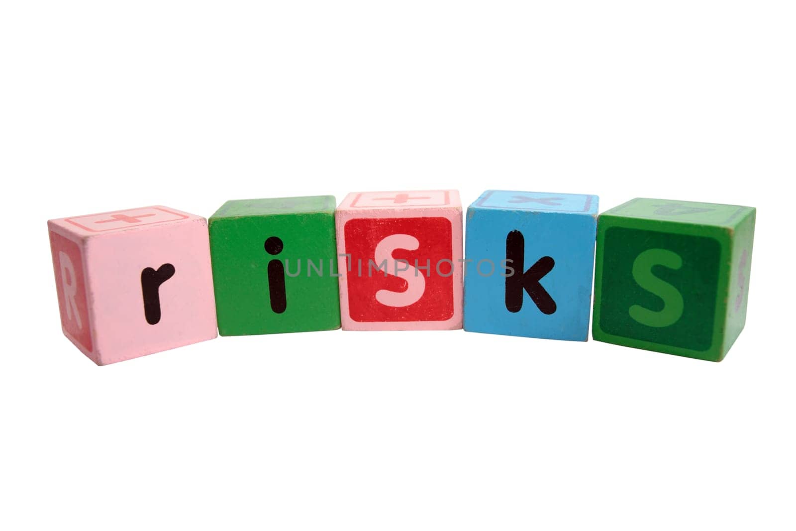 assorted childrens toy letter building blocks against a white background that spell risks with clipping path
