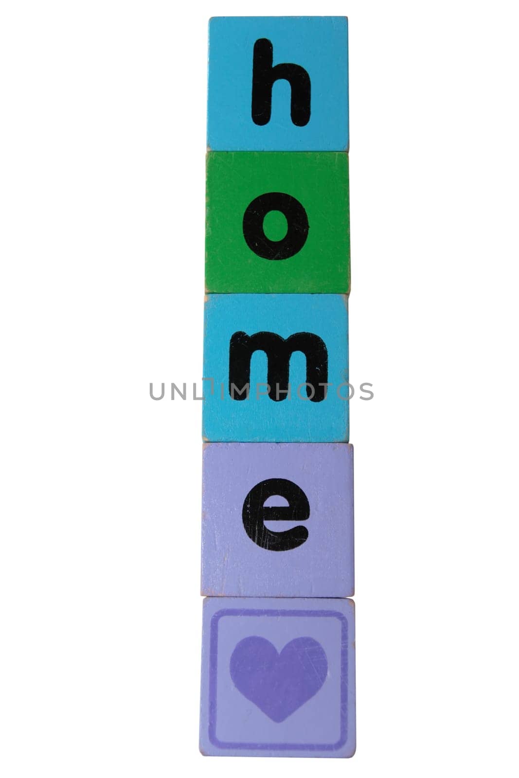 toy letters that spell home against a white background with clipping path with a heart shape